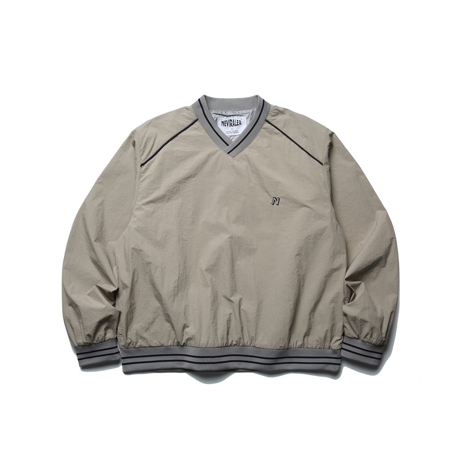 Beige-gray V-neck pullover jacket with gray striped ribbed trim and small embroidered N, front view