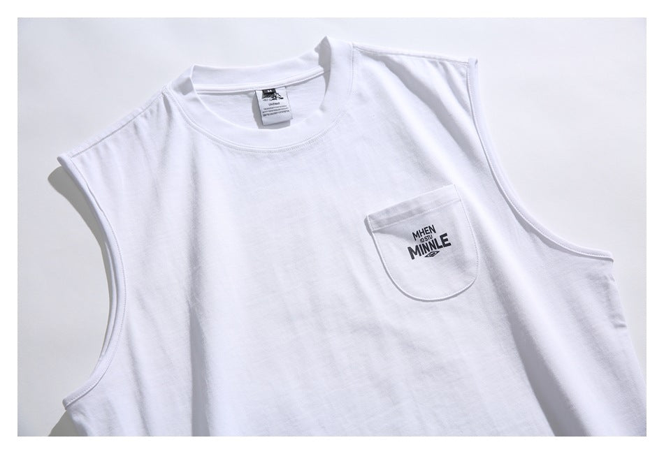 Close-up of the white shirt's crew neck, armhole seams, and printed chest pocket.
