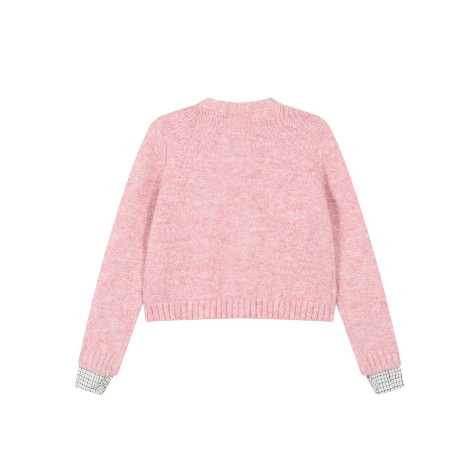 Back view of pink marled knit cardigan with ribbed hem and cuffs and grid-check cuff trim