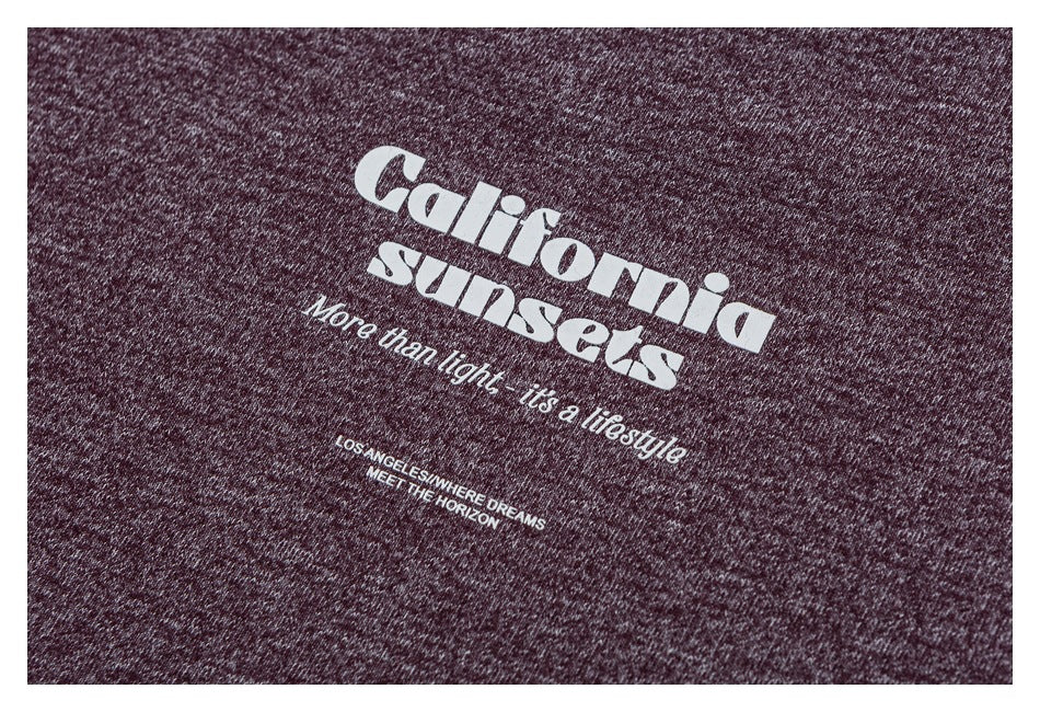 White “California sunsets” text graphic with smaller English lettering on burgundy heathered fabric.