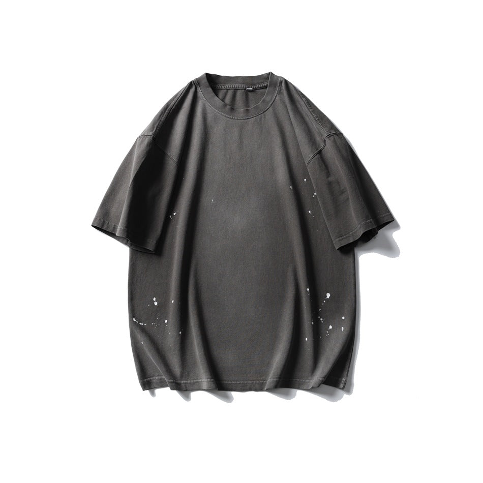 Iron gray washed short-sleeve crew-neck T-shirt with white paint splatter, flat front view