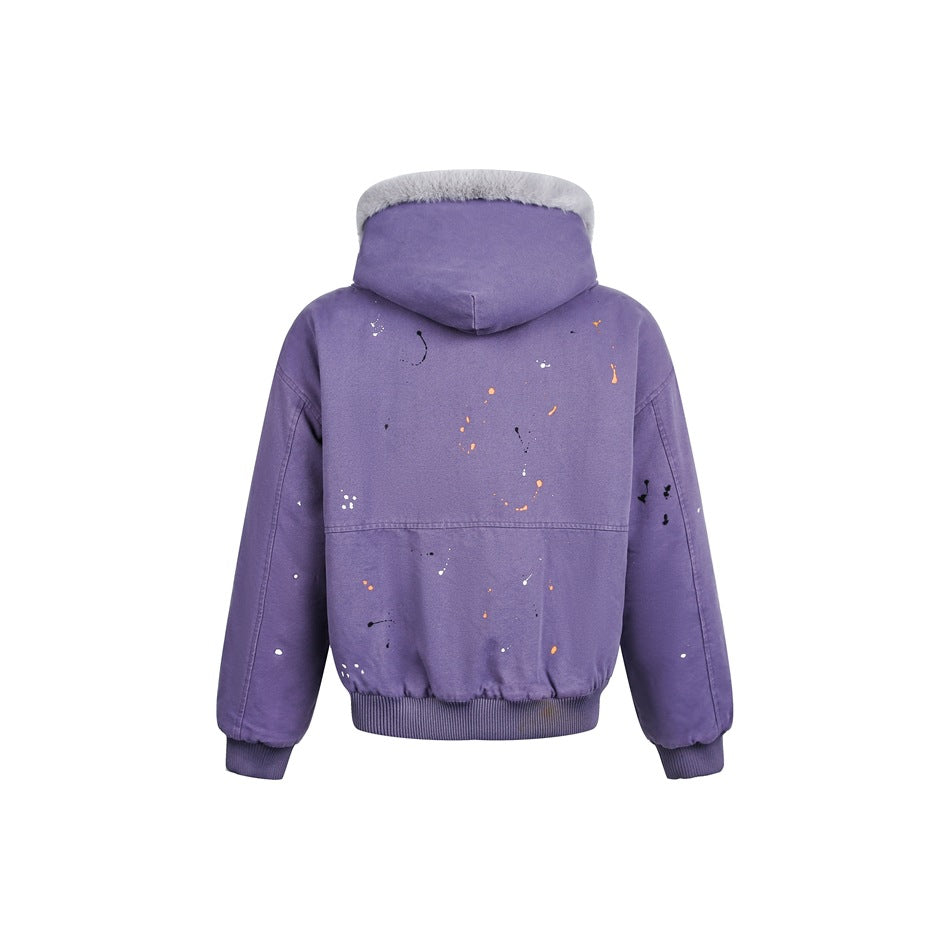 Rear view of a purple hooded jacket with gray fur trim, multicolor paint splatters, and ribbed cuffs and hem.