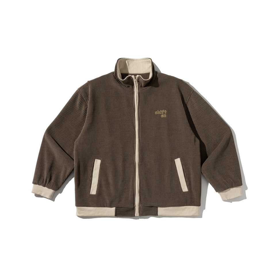 Coffee brown ribbed zip-front jacket with cream collar, zipper, pocket trim, cuffs and hem band, flat lay
