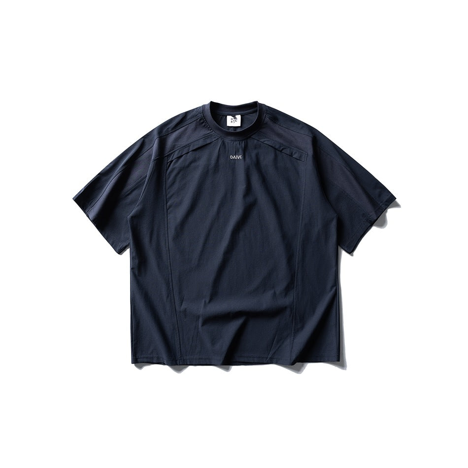 Navy short-sleeve crew-neck T-shirt with paneled seams and small chest print, flat lay front view