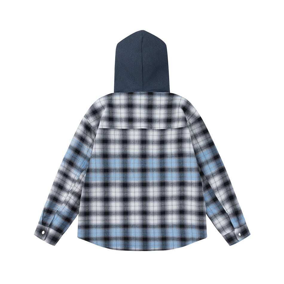 Back of a hooded overshirt with a solid dark blue hood and blue, black and white plaid body and sleeves.