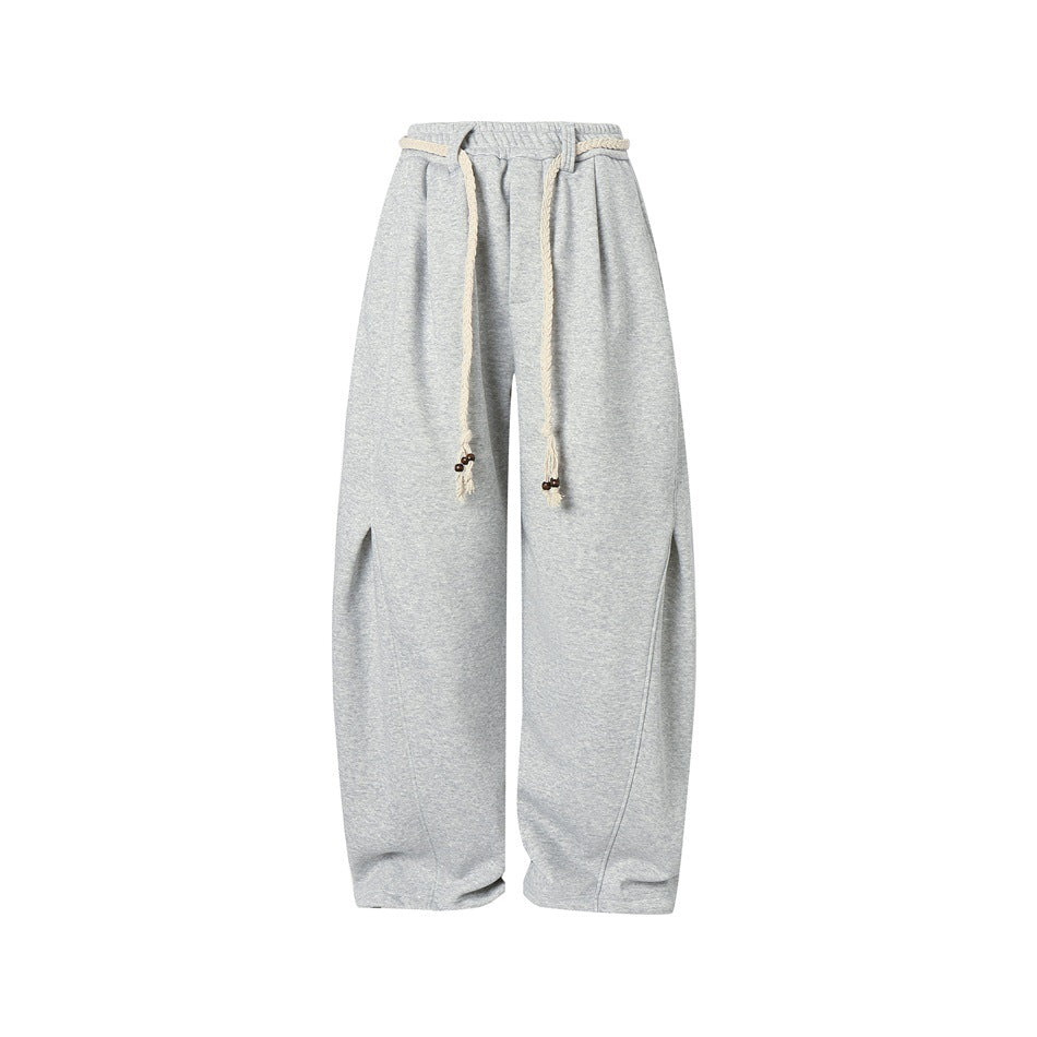 Heather gray wide-leg sweatpants, front view, with elastic waist and braided cream rope ties hanging with brown beads