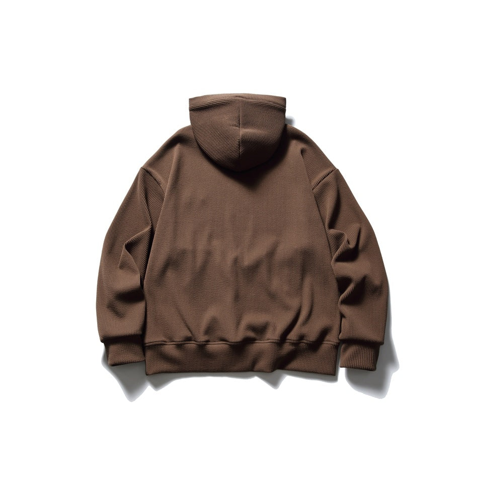 Back view of a brown pullover hoodie with a hood, long sleeves, and ribbed cuffs and hem.