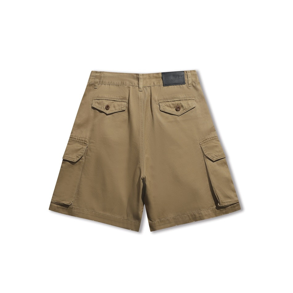 Back view of tan cargo shorts with buttoned back pockets and flap cargo pockets.