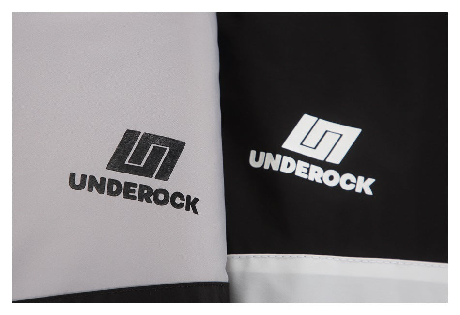 Close-up of black and light gray garment panels, each printed with an UNDEROCK logo.