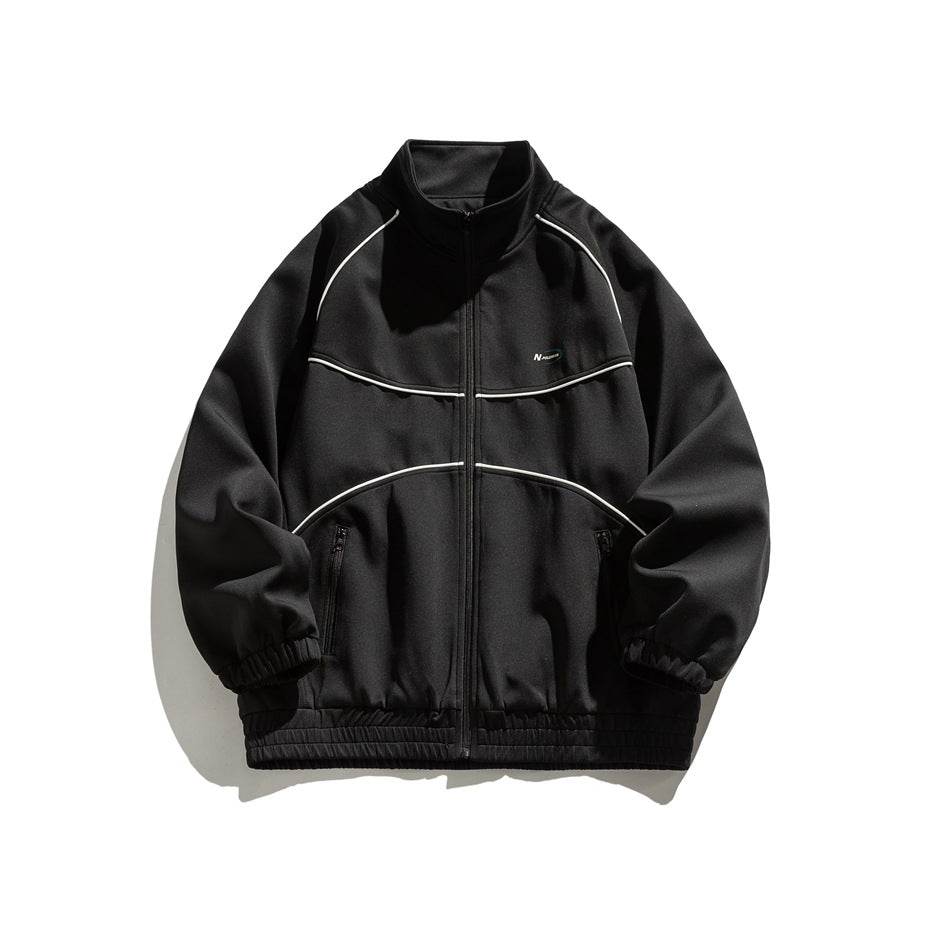 Black stand-collar zip jacket with white piping, zip pockets and elastic cuffs and hem, flat front view