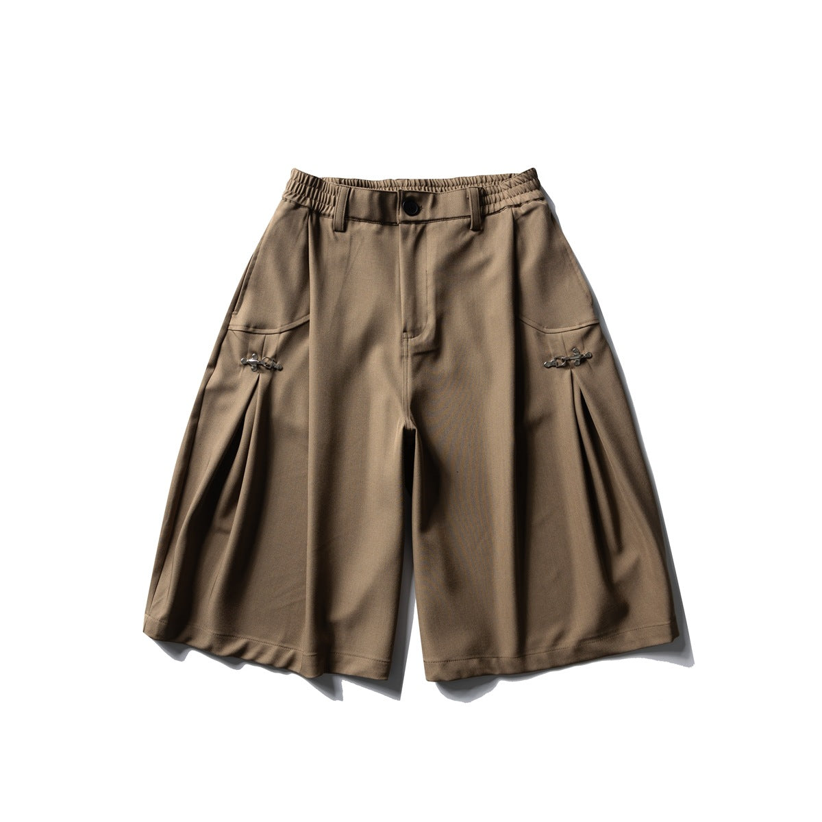 Khaki knee-length wide-leg shorts with elastic waist, button closure, side pleats and metal clasp details, flat lay front