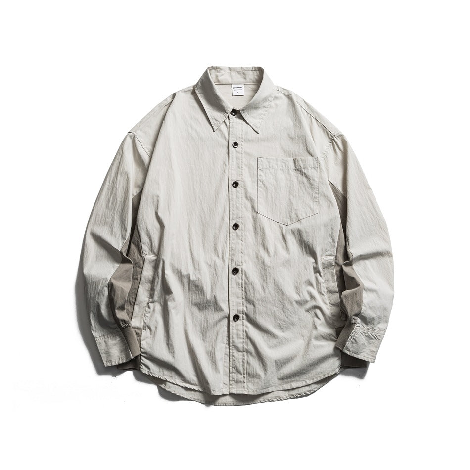 Beige long-sleeve button-up shirt with chest pocket and darker side panels, flat lay front view