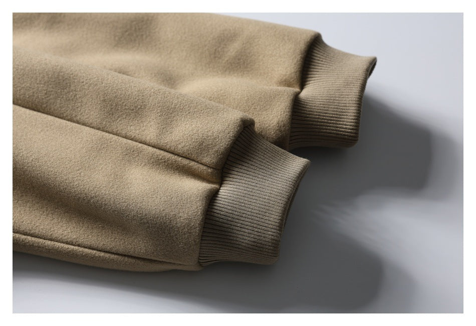 Close-up of the taupe jacket's sleeves and ribbed cuffs.
