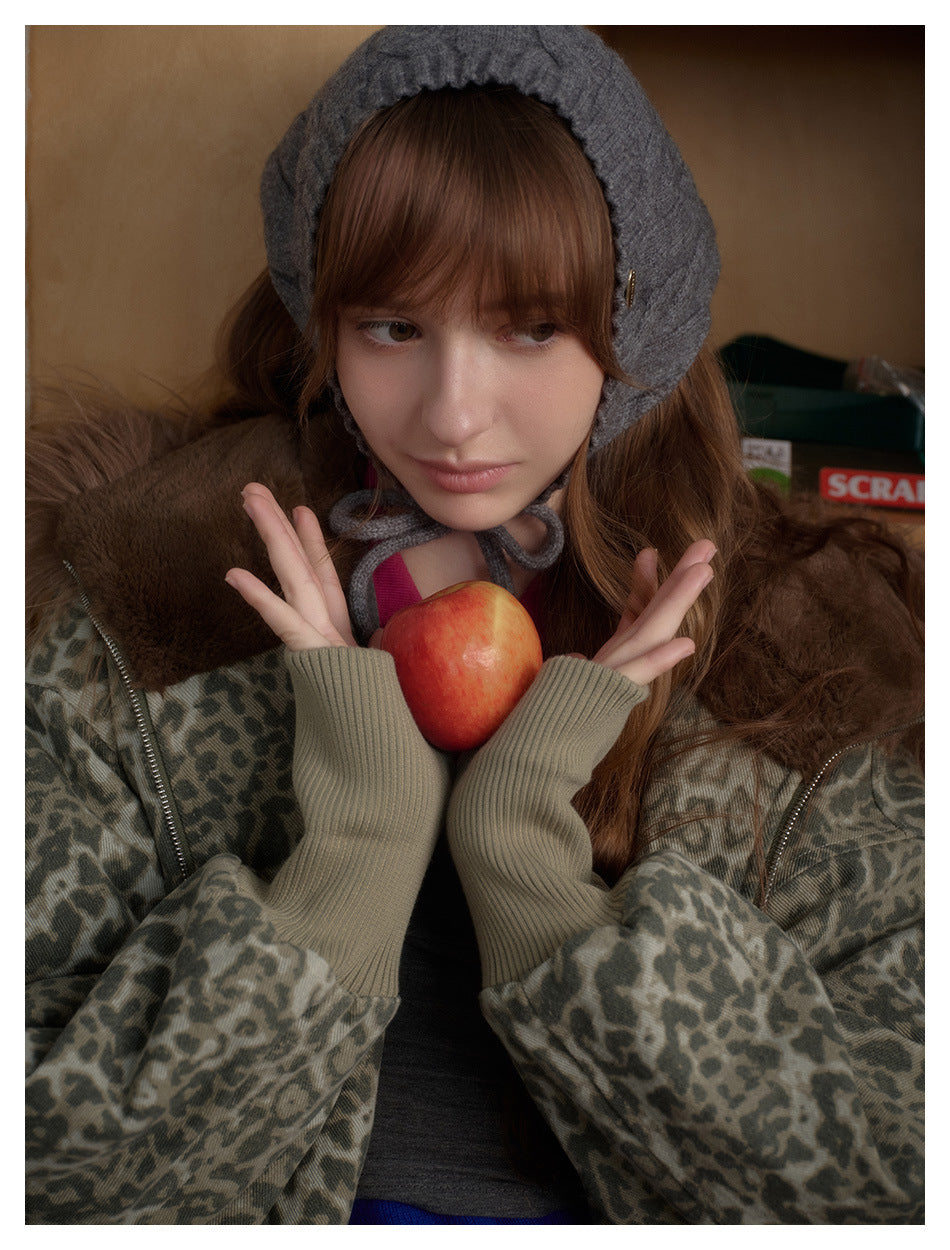 Close-up of the jacket's gray leopard print, brown fur-trimmed hood, zipper, and long ribbed cuffs.