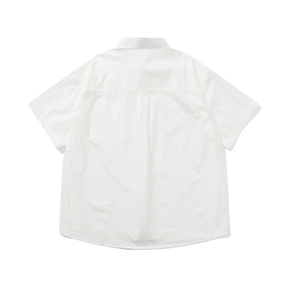 Back view of a white short-sleeve button-up shirt with a back yoke and center pleat.