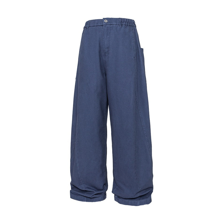 Blue wide-leg pants with elastic waistband, button fly, side patch pocket and curved leg seams, shown flat