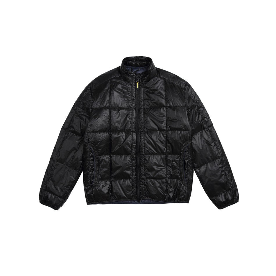 Black quilted puffer jacket with stand collar and front zipper, flat front view