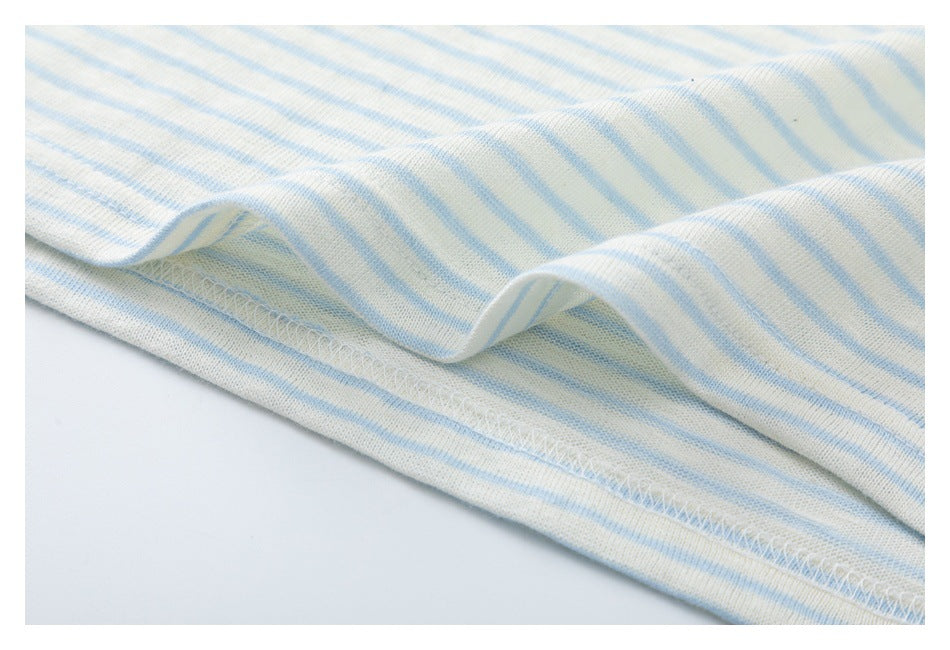 Close-up of pale blue and white striped knit fabric showing a stitched hem.