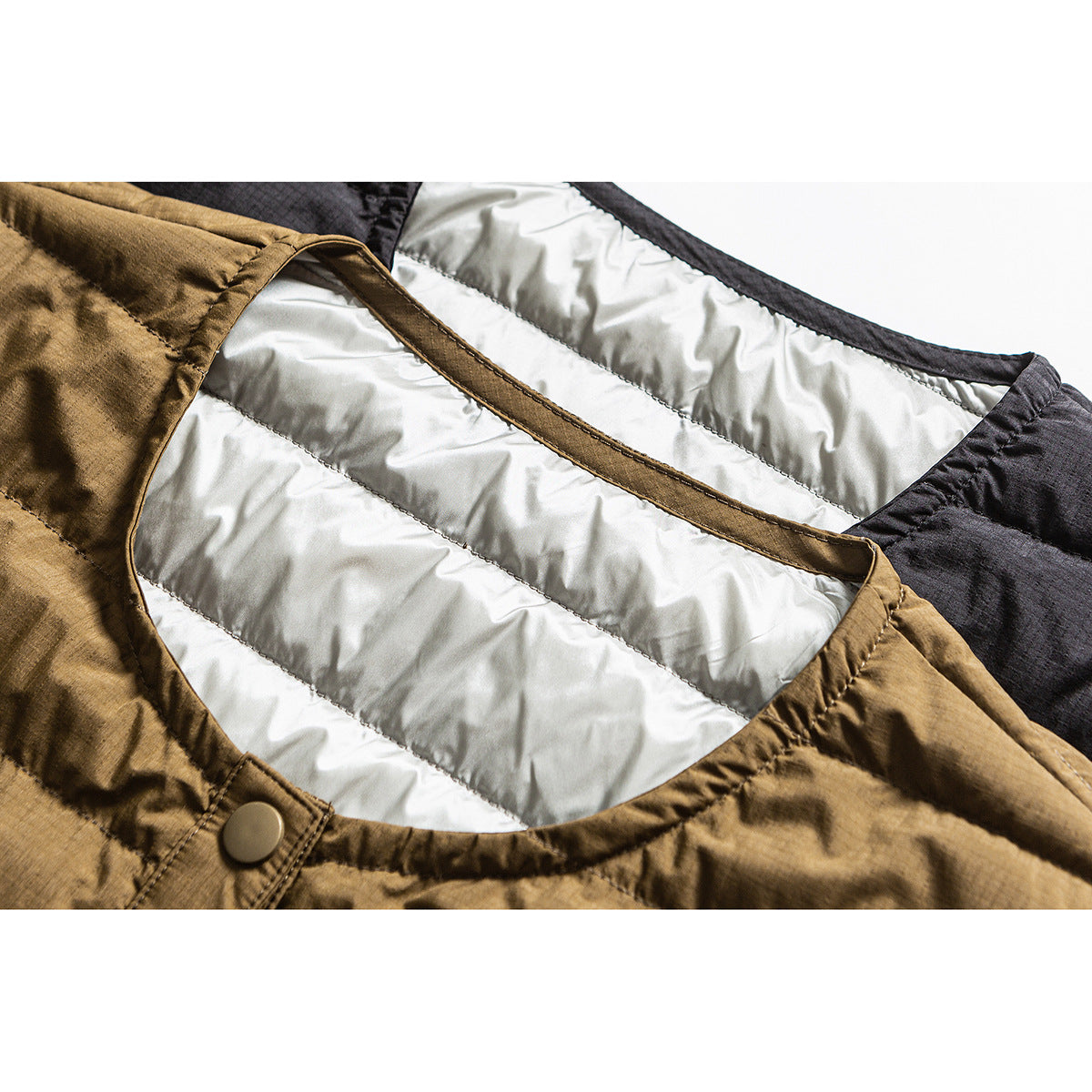 Close-up of a brown quilted jacket showing its light gray padded lining, bound neckline, and snap button.