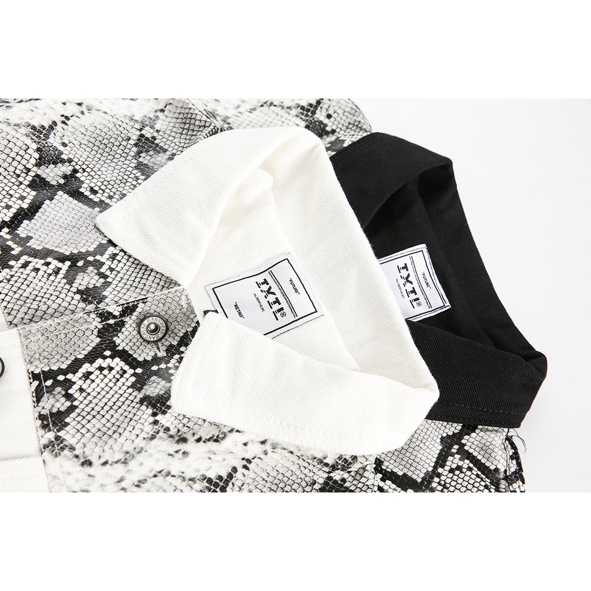 Close-up of a black-and-white patterned jacket collar with white and black inner labels.