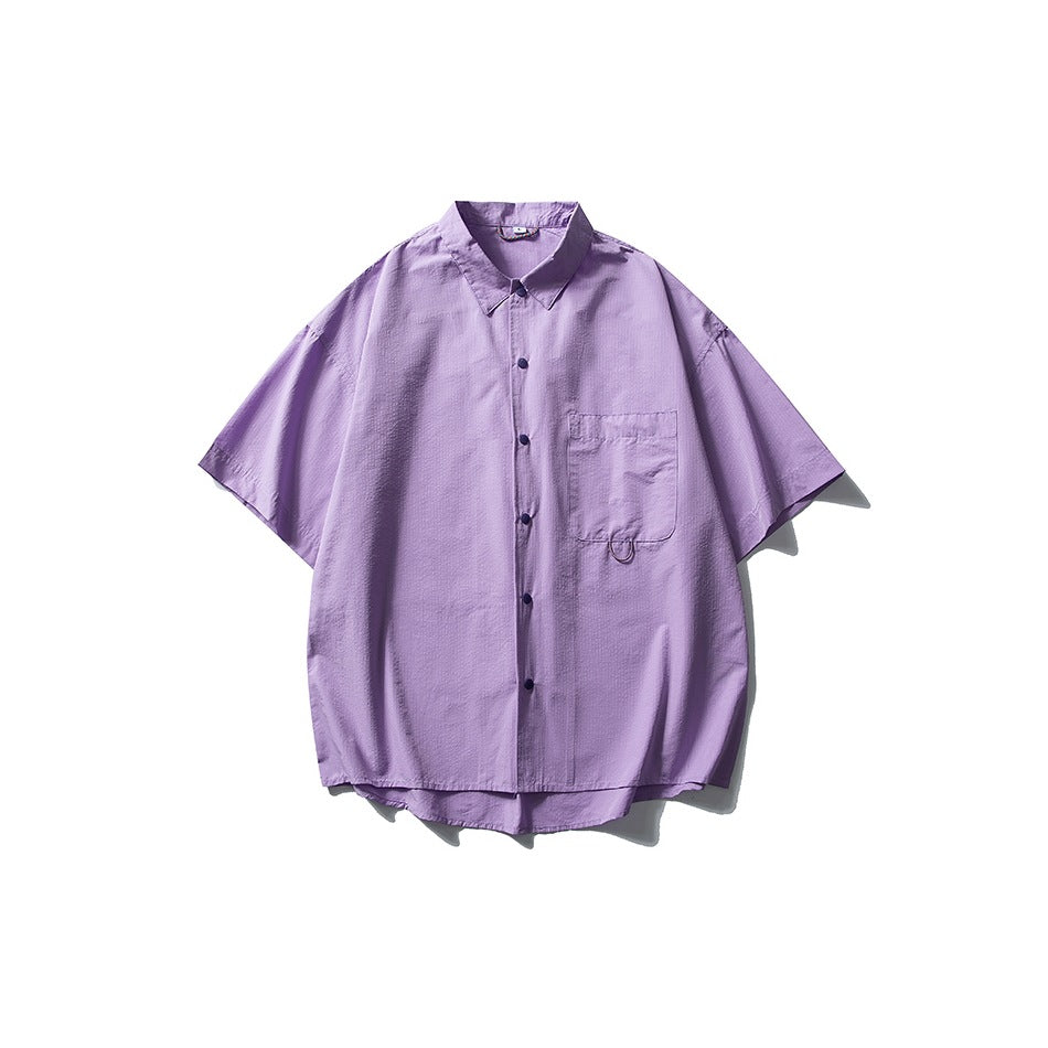 Lilac purple short-sleeve button-front shirt with collar and chest pocket, flat lay on white background