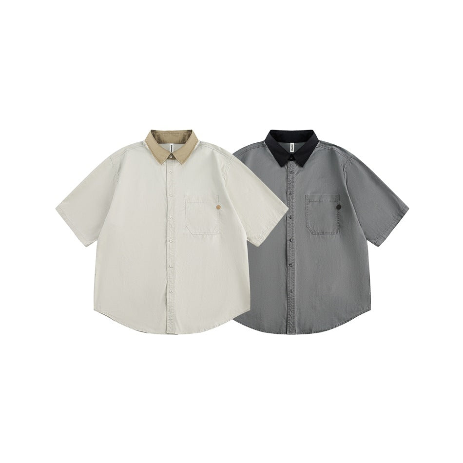 Front view of short-sleeve button-up shirts in light cream with a tan collar and gray with a black collar.