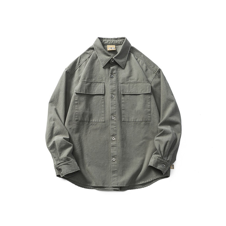 Dark gray-green long-sleeve button-up shirt with two flap chest pockets, laid flat, front view