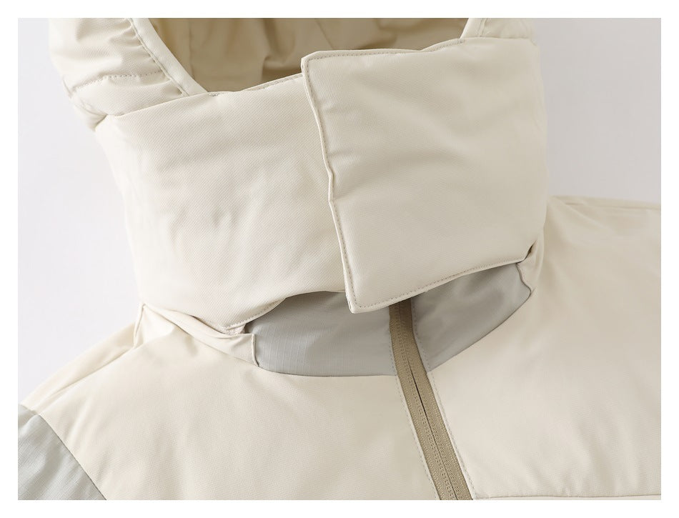 Close-up of a cream jacket's high collar, large overlapping flap, and tan front zipper.