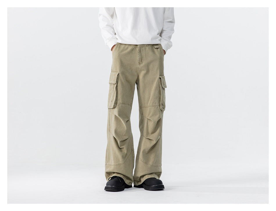 Model wearing light khaki wide-leg cargo pants with oversized flap pockets, front view.