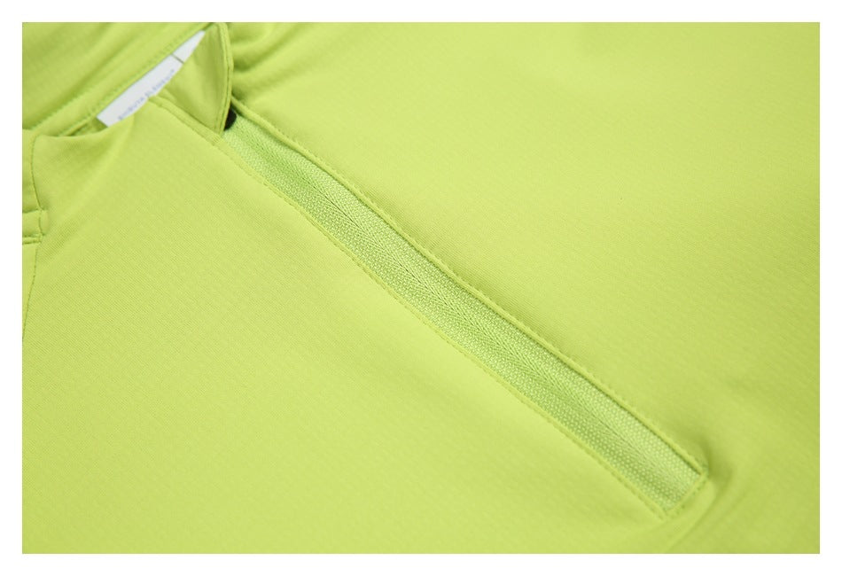 Close-up of the lime-green pullover's quarter-zip placket and smooth fabric.