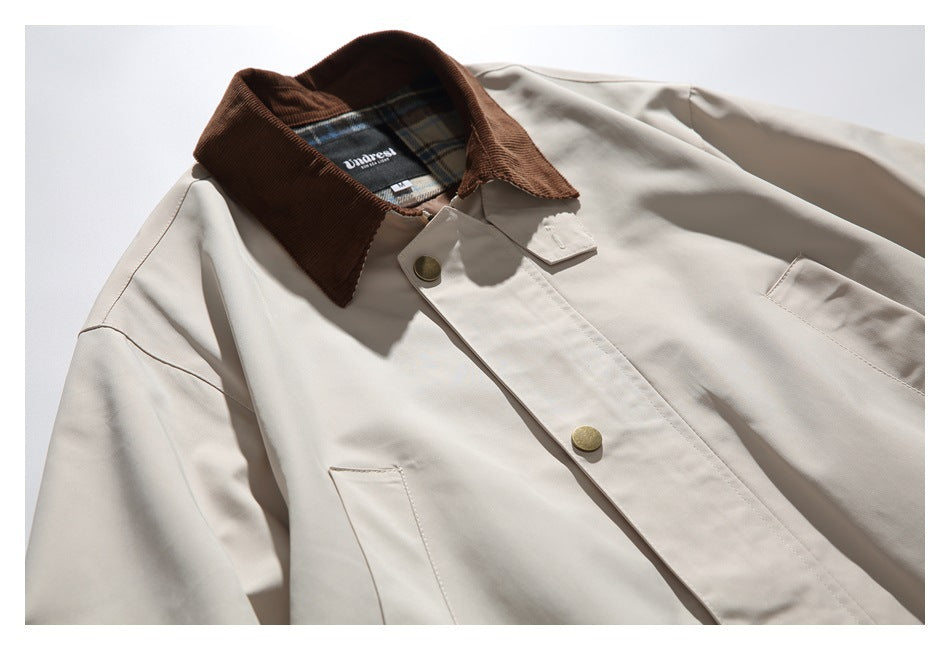 Close-up of the jacket's brown collar, plaid inner label area and upper button placket.