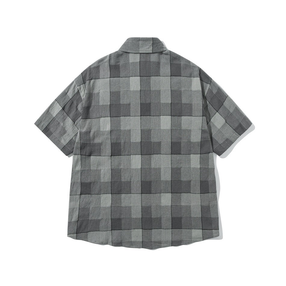 Back view of a short-sleeve shirt in a gray check pattern.