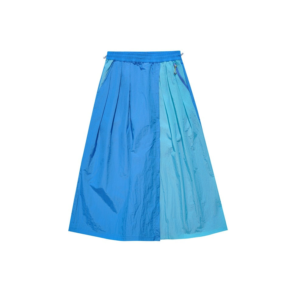 Blue two-tone color-block skirt-pants with elastic waist, pleats and side zip pocket, flat lay