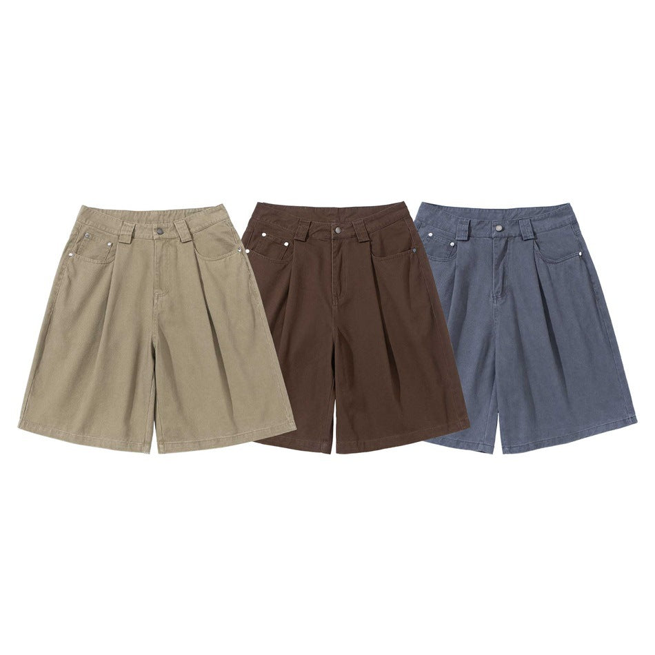 Three pairs of wide-leg shorts shown from the front in tan, dark brown, and slate blue.