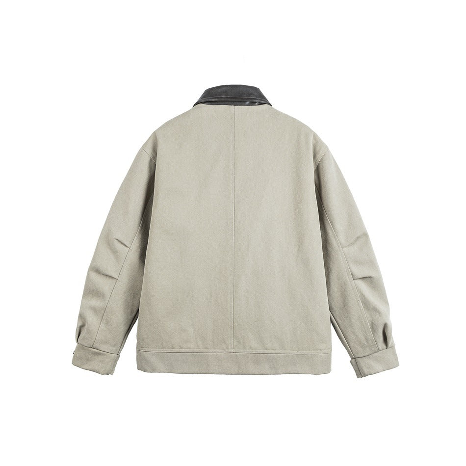 Back view of a beige jacket with a black collar, long sleeves, and a straight hem.