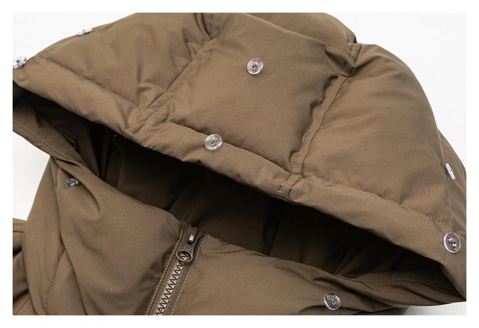 Close-up of the brown jacket hood showing snap fasteners, stitching, and the front zipper.