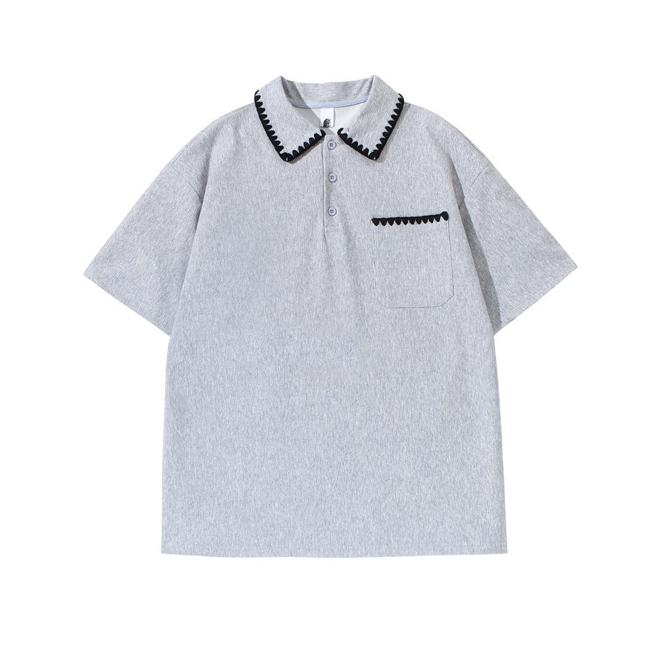 Heather gray short-sleeve polo shirt with black scalloped trim on the collar and chest pocket, flat front view