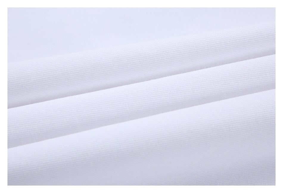 Macro view of white garment fabric folded into layers, showing its knit texture.