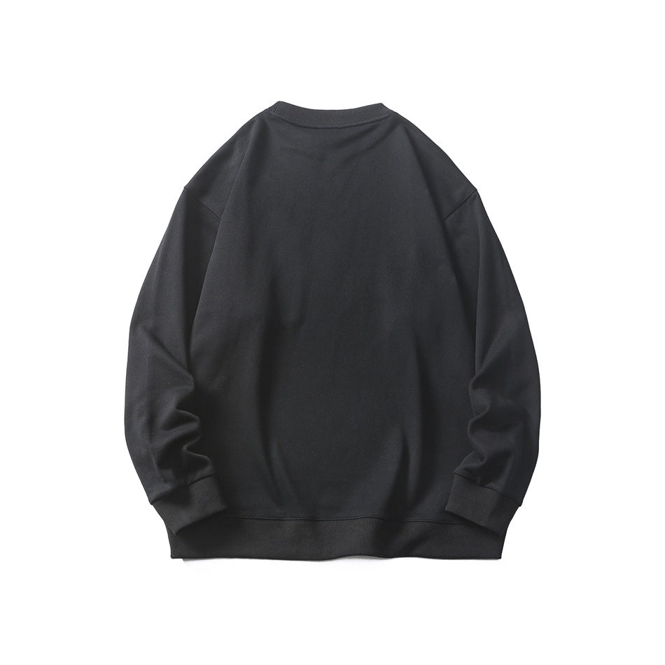 Back view of a black crewneck sweatshirt with long sleeves and ribbed cuffs and hem, shown flat on white.