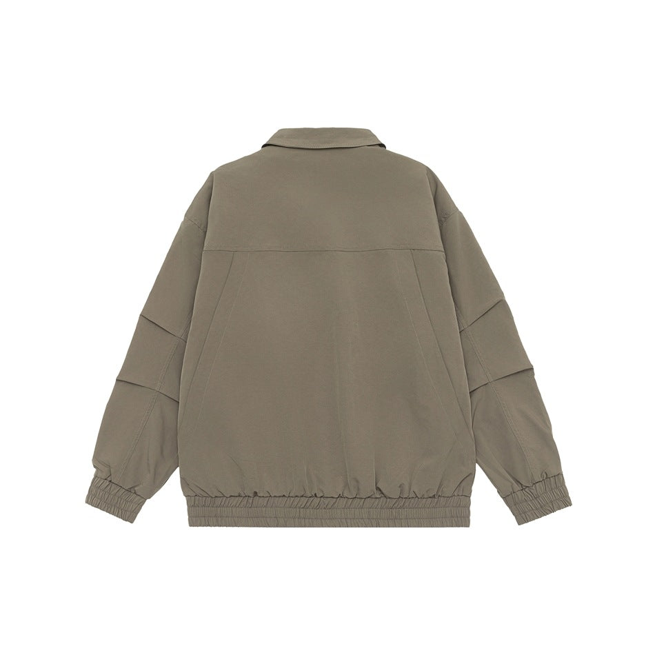 Back view of a taupe collared jacket with long sleeves, seam detailing, and elastic cuffs and hem on white.
