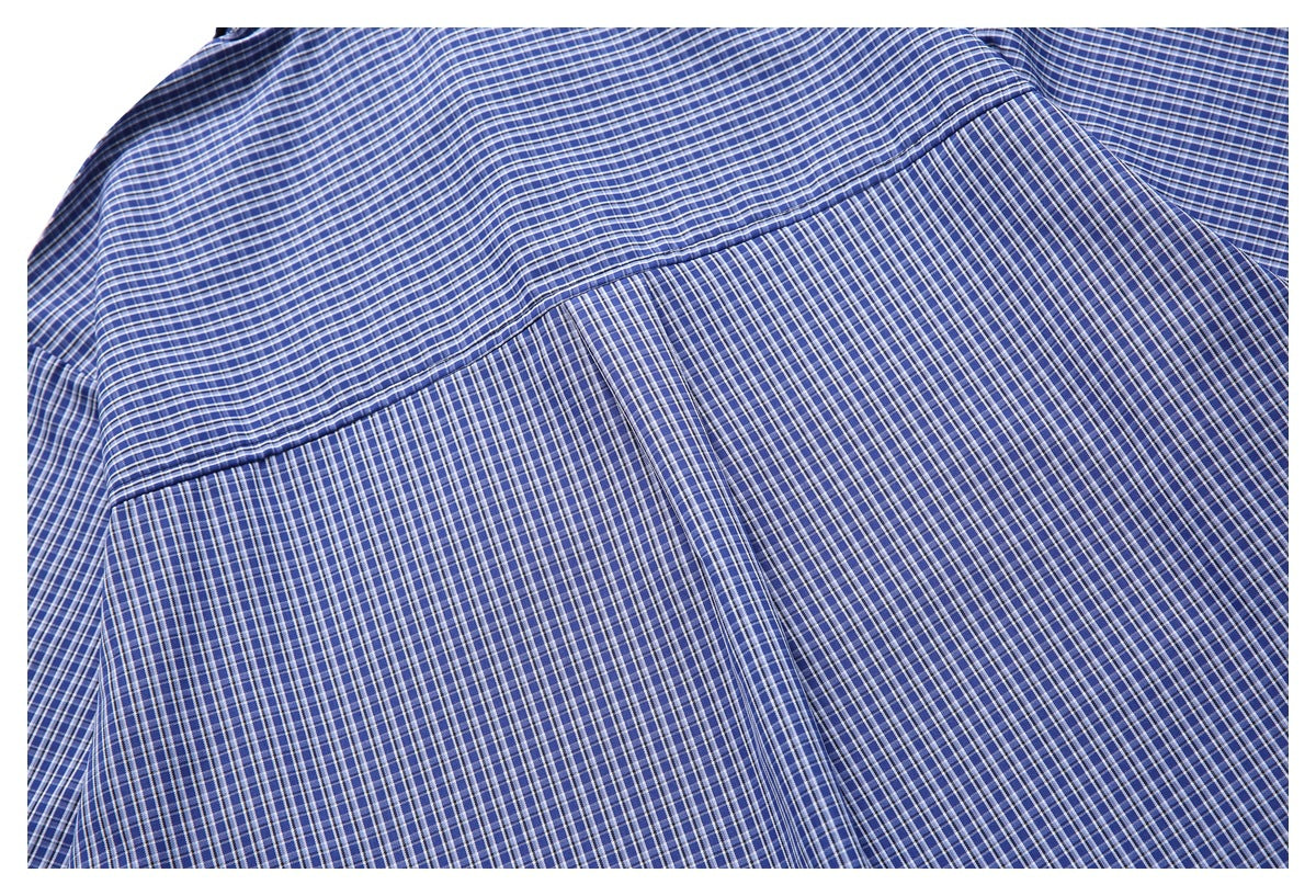Close-up of the back yoke seam on a blue-and-white checked shirt.