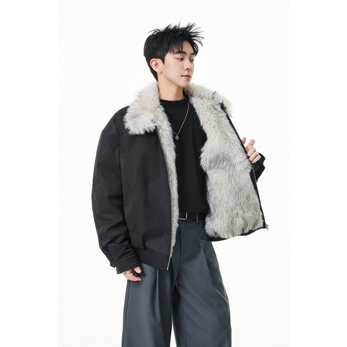 Model shows the front of a black zip jacket with a light gray faux-fur collar and fully visible lining.