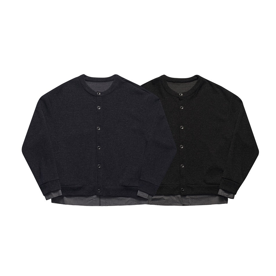 Two button-front cardigans, one charcoal and one black, with checked fabric visible at the cuffs and hems.