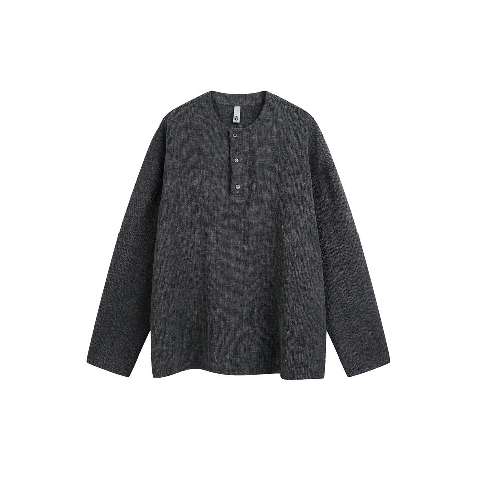 Dark charcoal long-sleeve Henley-style pullover with textured fabric and three buttons, flat front view