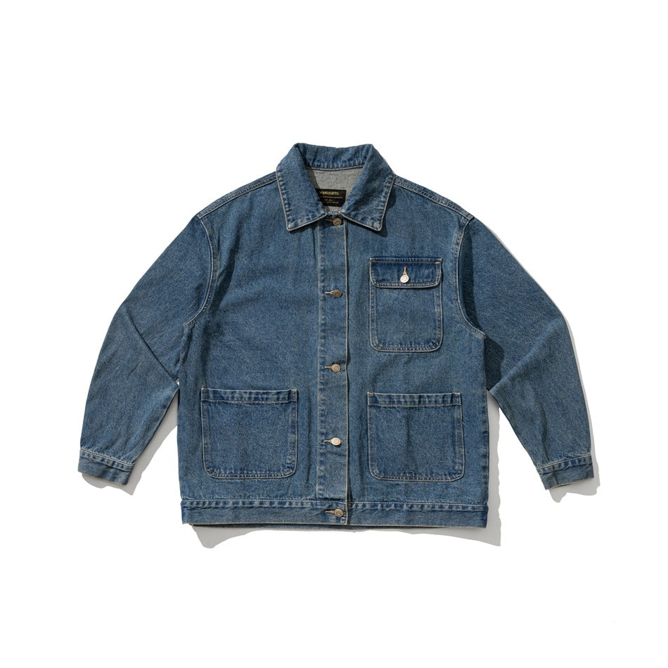 Blue washed denim jacket flat lay with collar, button front, chest flap pocket and two lower patch pockets