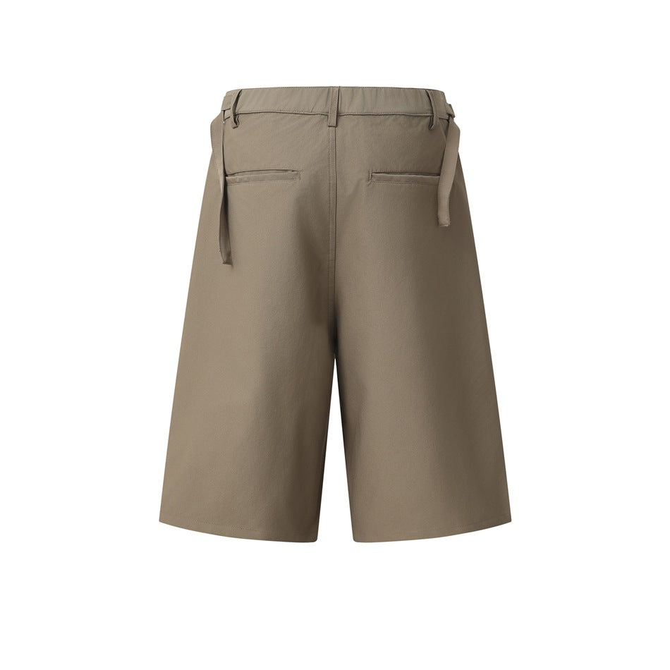 Rear view of taupe wide-leg shorts with belt loops, two welt pockets, and hanging side adjuster straps.