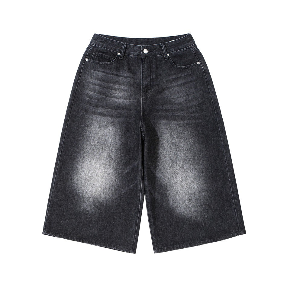 Washed black wide-leg cropped denim pants with faded thighs, flat front view on white background