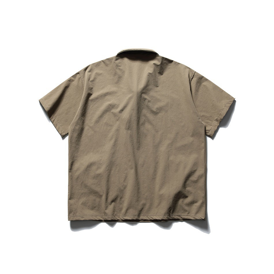 Back view of a taupe short-sleeve shirt with a collar.