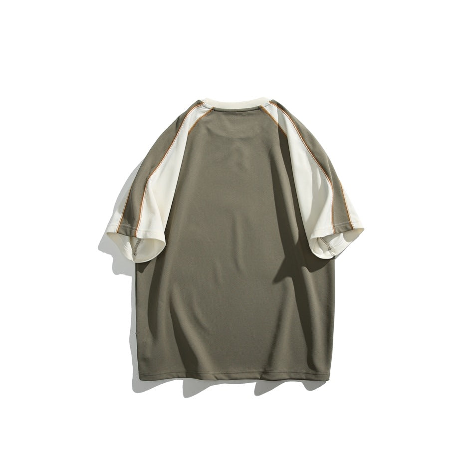 Back view of an olive-gray raglan tee with cream sleeve panels and contrast stitching, shown flat against white.