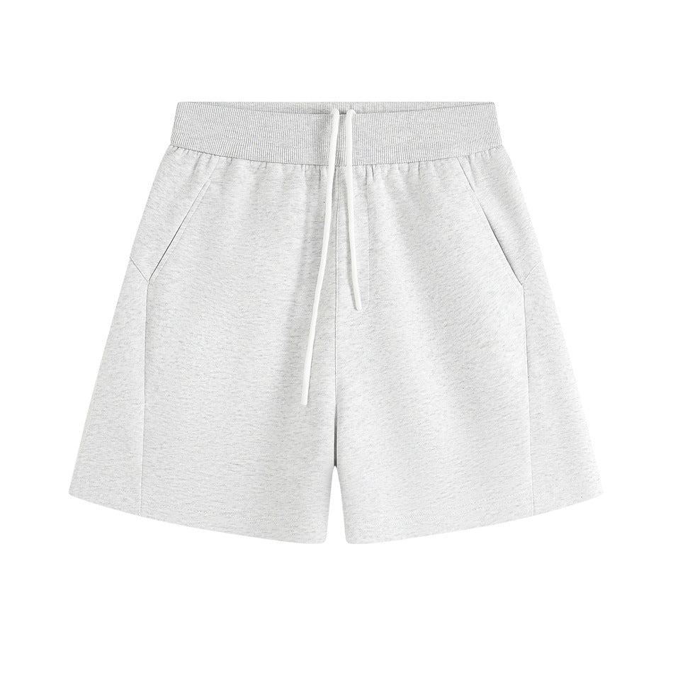 Light heather gray wide-leg shorts with white drawstring and slanted side pockets, flat front view